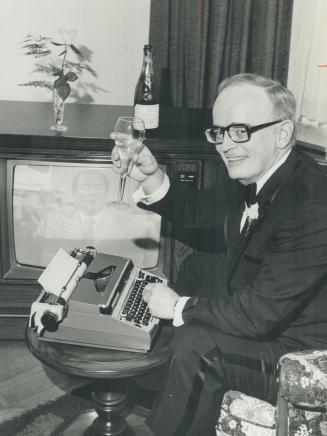 Here's looking at you! Jack Miller, with tools of his trade -- typewriter and television set -- toasts himself with champagne on his 25th anniversary as a television writer