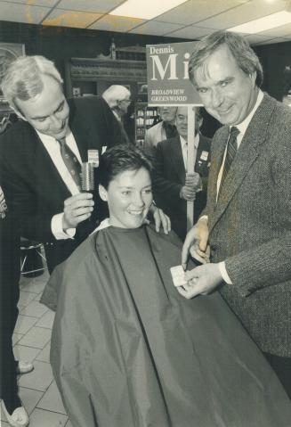 Campaigning with Liberal candidate Dennis Mills in Broadview-Greenwood yesterday, Premier David Peterson combs Karen Visser's hair during a beauty sal(...)