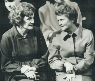 Wives meet: Premier Frank Miller's wife, Ann, left, talks with Kathleen Davis, the wife of former premier William Davis, at Queen's Park ceremonies yesterday as Miller's cabinet was sworn in