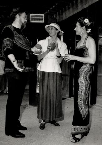 Above, Peter Mehren in an embroidered shirt from Nairobi, Elaine Munro in a Clotheslines outfit, and Dr. Kay Mehren in a taifa cloth dress that also came from Nairobi