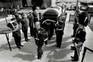 Last detail: An honor guard of eight pall bearers from four distinguished Canadian regiments carries the casket of former Governor-General Roland Michner into church for yesterday's prayer service