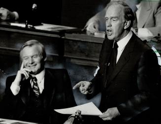 Laughing the blues away? Premier William Davis appears to be smiling as Treasurer Frank Miller announces his budget plans for the coming year. Miller,(...)