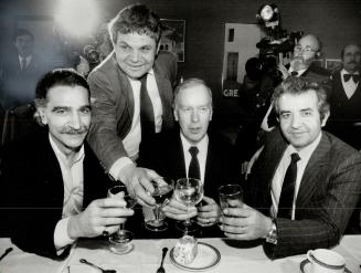 Miller meets with Greeks. Frank Miller, who will be sworn in as Ontario Premier today, enjoys a toast with members of the Greek community yesterday at(...)