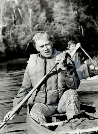 Ontario's new treasurer Frank Miller canoes up the Madawaska River to fulfil a promise made when he was natural resources minister. Would he like to b(...)
