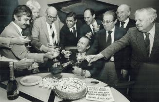 Here's to ya, Ed. Champagne and cake - what better way to an honest man's heart? With glasses raised, employees gathered round to wish Ed Mirvish luck(...)