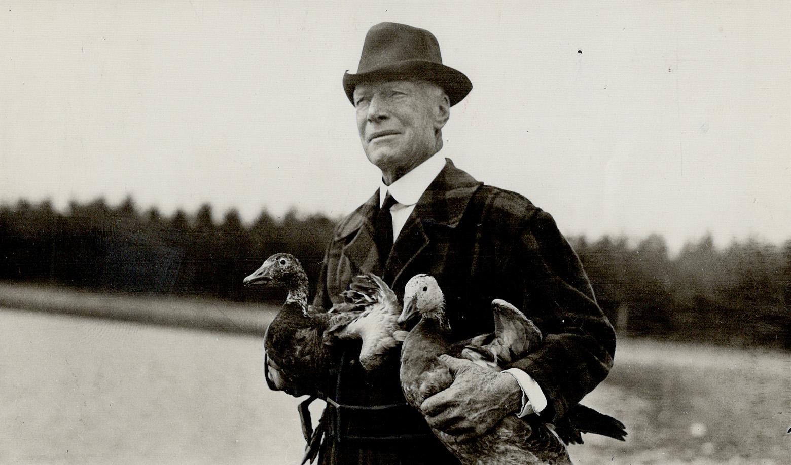 Jack Miner, Canadian naturalist about to liberate a pair of blue geese to study their route of migration