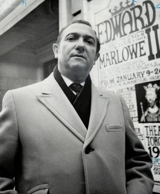 Edwin (Honest Ed) Mirvish stands outside his Royal Alexandra Theatre which he claims may be forced to close due to competition from city-owned theatres