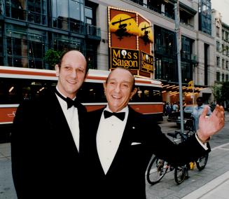 At last: David and father Ed Mirvish have reason to smile last night as they stand in front of the Princess of Wales Theatre before the Canadian premiere of their Miss Saigon