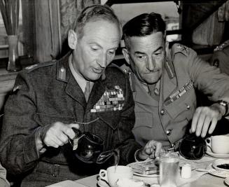 Pouring himself a cup of tea, Field Marshal Viscount Montgomery is seen in conversation with Maj