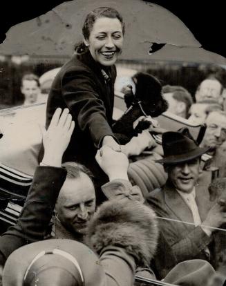 The days when she received the plaudits of the world, top, for her daring, record breaking flight from England to Australia