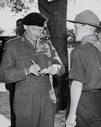 Monty gives his autograph to Patrol Leader Albert Enns, lucky Boy Scout in Winnipeg