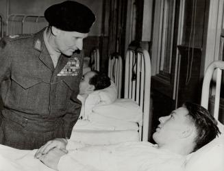 Conqueror of Rommel, Lord Montgomery talks with Pte