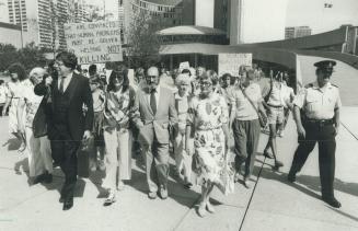 Vows fight: Dr. Henry Morgentaler, centre, walks away from press conference at Toronto city hall surrounded by media soon after ruling to uphold Canad(...)