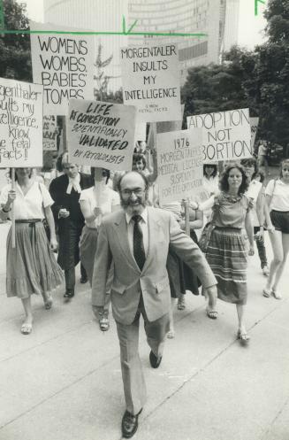 Thrill of victory: Dr. Henry Morgentaler basked in his victory and ignored protesters yesterday outside the University Ave. courthouse after a judge upheld his release on bail
