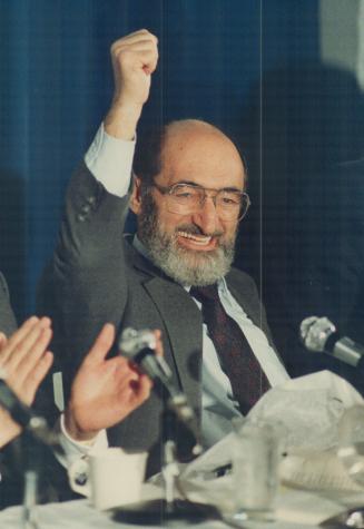 Cheers: Dr. Henry Morgentaler raises his arm in victory after the Supreme Court of Canada ruling five years ago