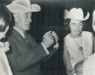 Earl Mountbatten sporting a white stetson as a memento of his role as yesterday's guest of honor at the Calgary Stampede arrived at Toronto airport la(...)