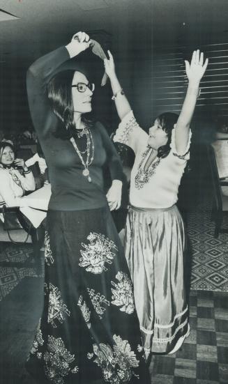 Nana Mouskouri and Mepaxia Danakas, 9, dance last night at the Danakas Palace Club