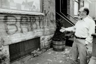 Dr. Henry Morgentaler stands outside his Harbord St. abortion clinic yesterday after vandals spray-painted the words Baby kill across the front of the(...)