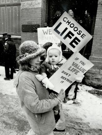 Opposing sides: Canada has proved very well to the world that you do not need an abortion law, says abortion clinic operator Dr. Henry Morgentaler, above. Pro-life protestors, right, disagree
