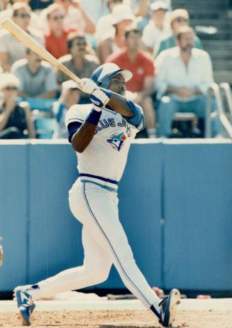 Slam swing: The pitch was up around his eyes and he admitted later he should never have taken a swing at it, but swing he did and out it went for Lloyd Moseby's second career grand slam
