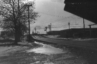 Jane St., looking south to railway crossing north of Weston Road. Toronto, Ontario