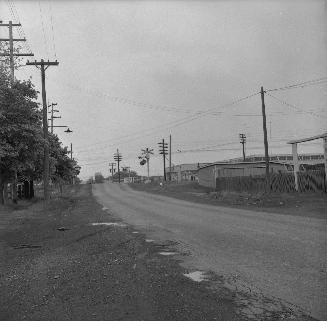 Jane St., looking south to railway crossing north of Weston Road. Toronto, Ontario