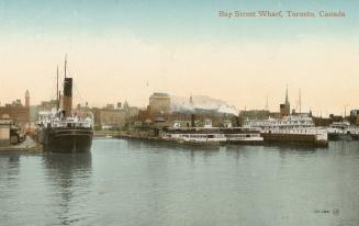 Image shows a few boats at the wharf.