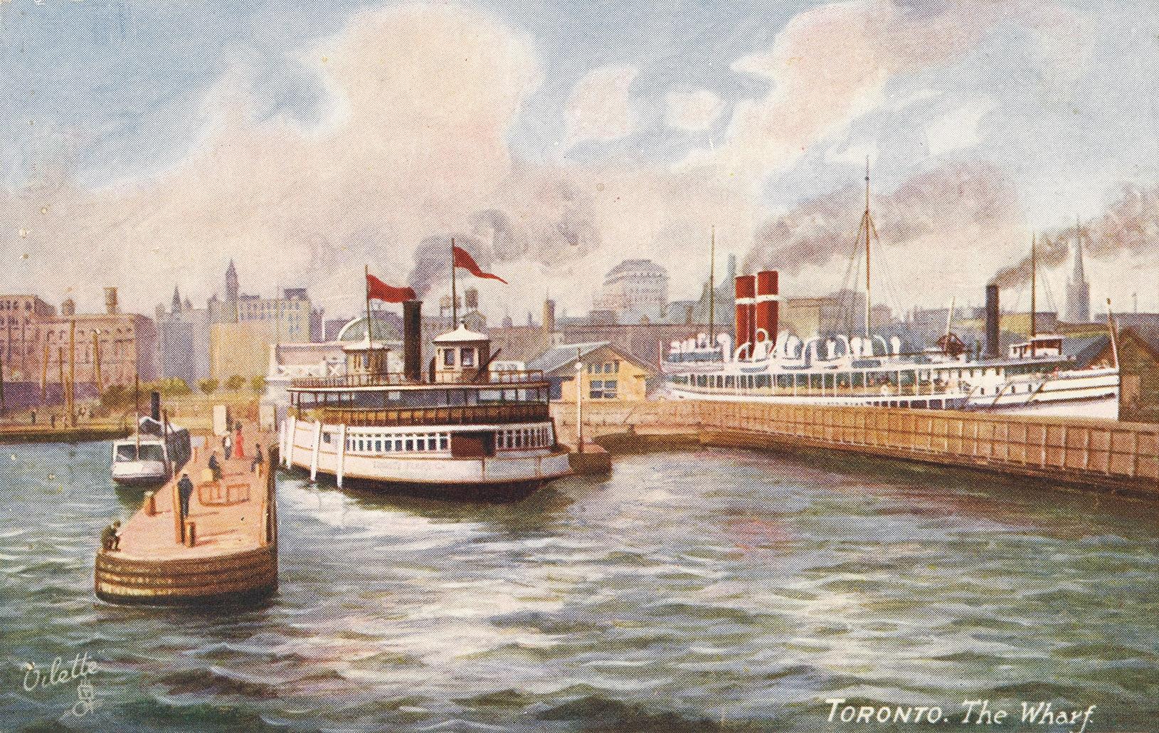 Image shows a few boats on the lake with some Harbour buildings in the background.