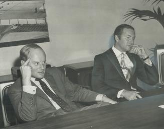 Clairtone Sound Corp. president Peter Munk (left) and vice-president David Gilmour listen at press conference after annual meeting in Toronto yesterda(...)