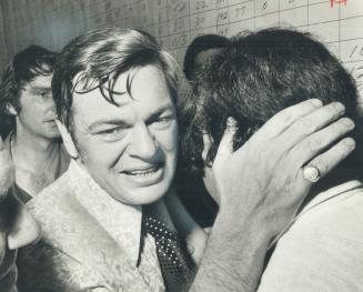 After his sixth, and biggest, victory in Hamilton East, Labor Minister John Munro hugs a supporter last night