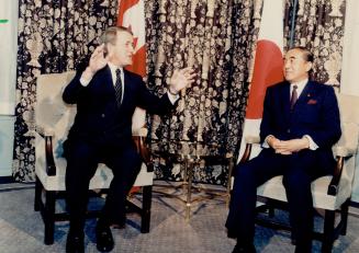 Prime Minister Brian Mulroney confers with Japanese leader Yasuhiro Nakasone on his recent visit to Canada