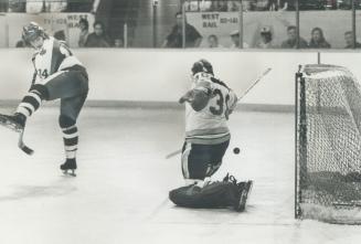 Fancy move, Toronto Marlboros' ace Mark Napier deflects a shot with a slick move between his legs, but New Westminster goalie Gord Laxton manages to t(...)