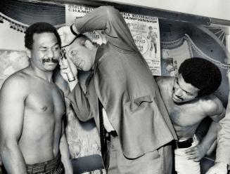 It really didn't hurt, World welterweight champion Jose Napoles winces as Dr. Jerry Zownir examines his ear