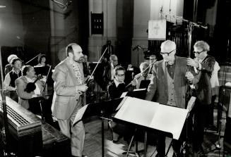 Recording session, That's Dr. Boyd Neel, renowned baroque maestro, centre, during one of the recording sessions for his new album The Pachelbel Canon (...)