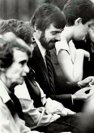 Nelles' fiance, Bearded Jim Pines listens in the public gallery as his fiancee, Nurse Susan Nelles, tells a royal commission about the circumstances surrounding three babies' deaths