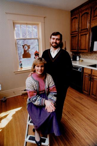 Ten years on, Susan Nelles sits with husband, Jim Pine, in their Belleville home