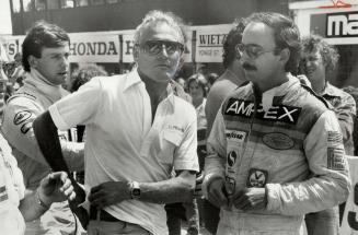 Actor Paul Newman chats with drivers before the race