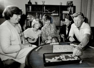 Scrabble strategy, Aideen Nicholson, far left, enjoys an evening of Scrabble with close friends the Speed family