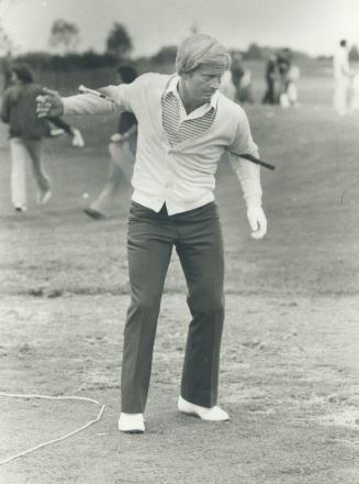 Warming up. Jack Nicklaus bends and twists with putter behind his back as he warms up at Glen Abbey today. Nicklaus, who designed the course, it among(...)