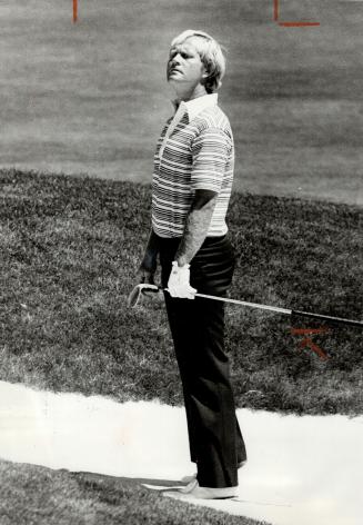 Jack Nicklaus. Looks over his course