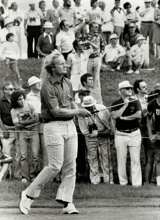 Golfer Jack Nicklaus keeps his eye on the ball, above, during the Canadian Open championship