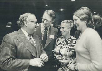 Nixon, centre, chats with phil and min givens