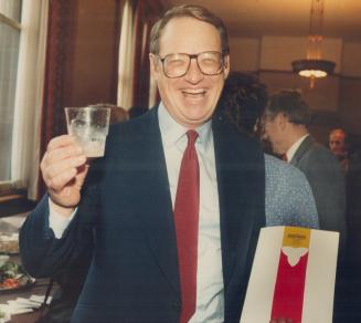 Chequebook cheers, A beaming Treasurer Robert Nixon hoists a glass of 7-Up after delivering the first Liberal budget in 42 years. But the mud's in the(...)