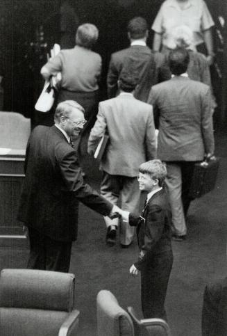 End of an era, Interim Liberal Leader Bob Nixon, Ontario's longest-serving MPP, bids farewell to a Legislature page yesterday after resigning his sear to become agent-general in London