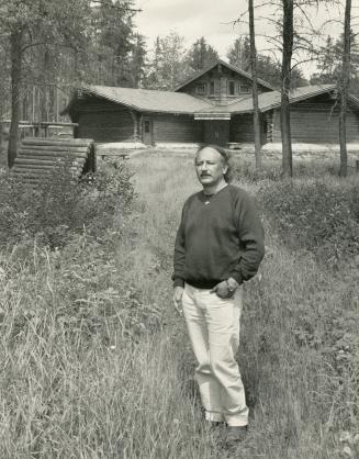 Handhewn school - Community leader and school board chairman Don Patience, 47, a Metis, stands in front of the school Collins built with craftsmanship admired in Ontario