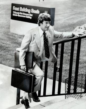 Keith Norton, elected Conservative MPP for Kingston in 1975, runs up the stairs of the Frost building at Queen's Park in his new job as parliamentary assistant to Treasurer Darcy McKeough