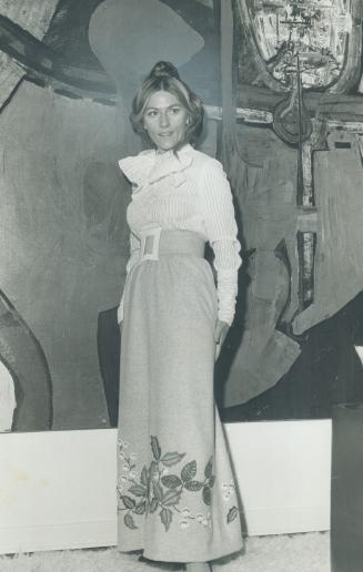 Iris Nowell, writer. She wears gray skirt, lace blouse