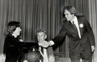 Pretenders to Parliament, Liberal David O'Connor extends a hearty handshake to the New Democrat Party's Lynn MacDonald