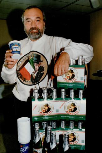 Heady move, Labatt Brewing president Sydney Oland samples Moretti beer, from an Italian brewer in which Labatt will acquire a controlling interest