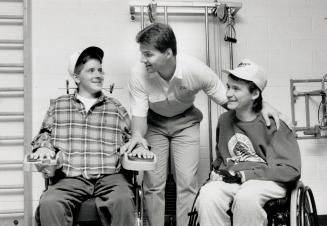 Eddie O Lends a hand, Leaf Ed Olczyk, centre, took a special interest in Kurt Gengenbach, left, and Andre Despres, young hockey players who became qua(...)